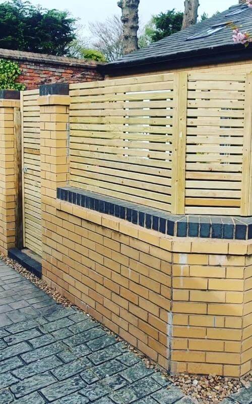 44mm pressure-treated slats have been used to create this small fence panel and gate.