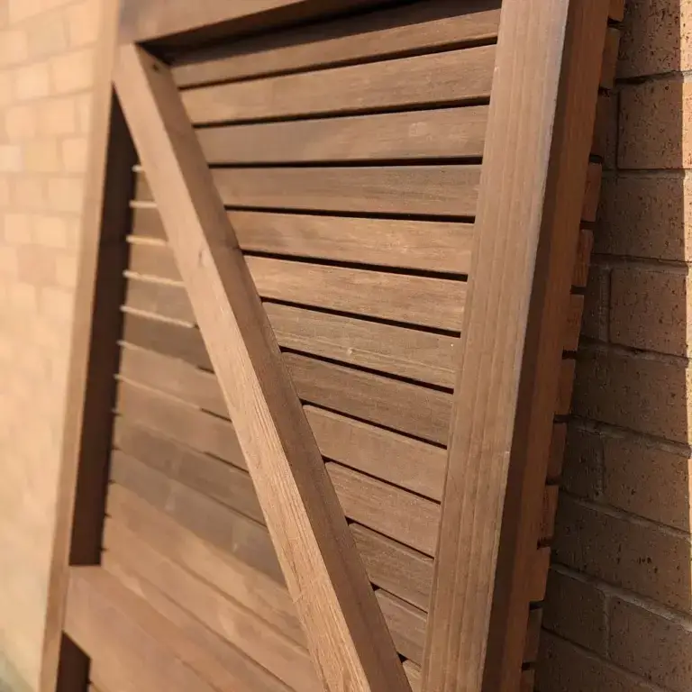 The rear side of the slatted tulip wood gate shows how the framing timbers have been used to create a sturdy gating option.